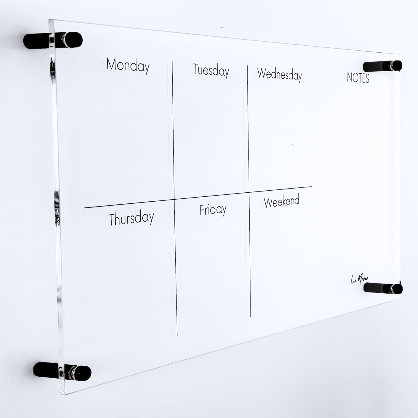 Lux Navia wall-mounted clear acrylic weekly planner featuring sections for each day of the week and a 'NOTES' column, designed with a sleek, modern, and minimalist aesthetic.