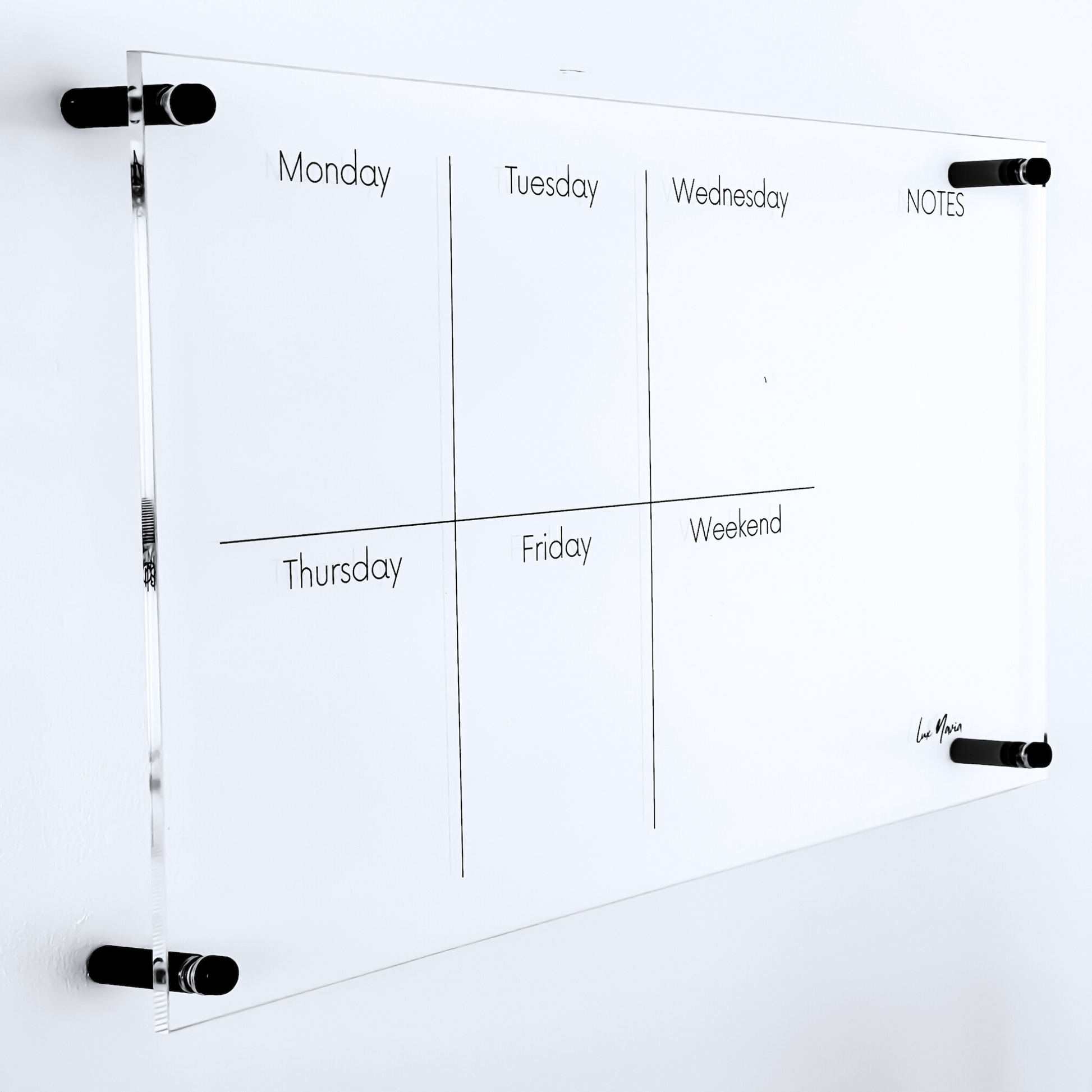Lux Navia wall-mounted clear acrylic weekly planner featuring sections for each day of the week and a 'NOTES' column, designed with a sleek, modern, and minimalist aesthetic.