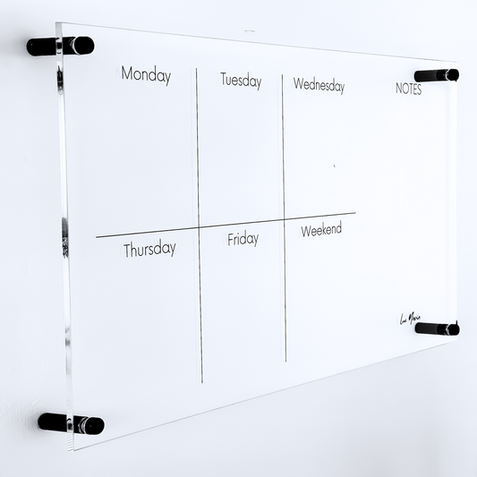Lux Navia wall-mounted clear acrylic weekly planner featuring sections for each day of the week and a 'NOTES' column, designed with a sleek, modern, and minimalist aesthetic.